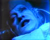 The Doctor (Jon Pertwee) struggles against the G-force as he heads toward space.